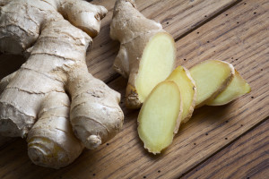 Root of ginger on wooden table